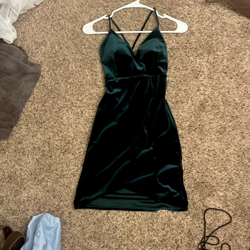 Mini dark green velvet dress. Size small. Has built in padding.